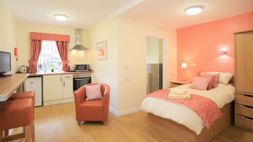 Bedroom with kitchenette at Bowden Lodge
