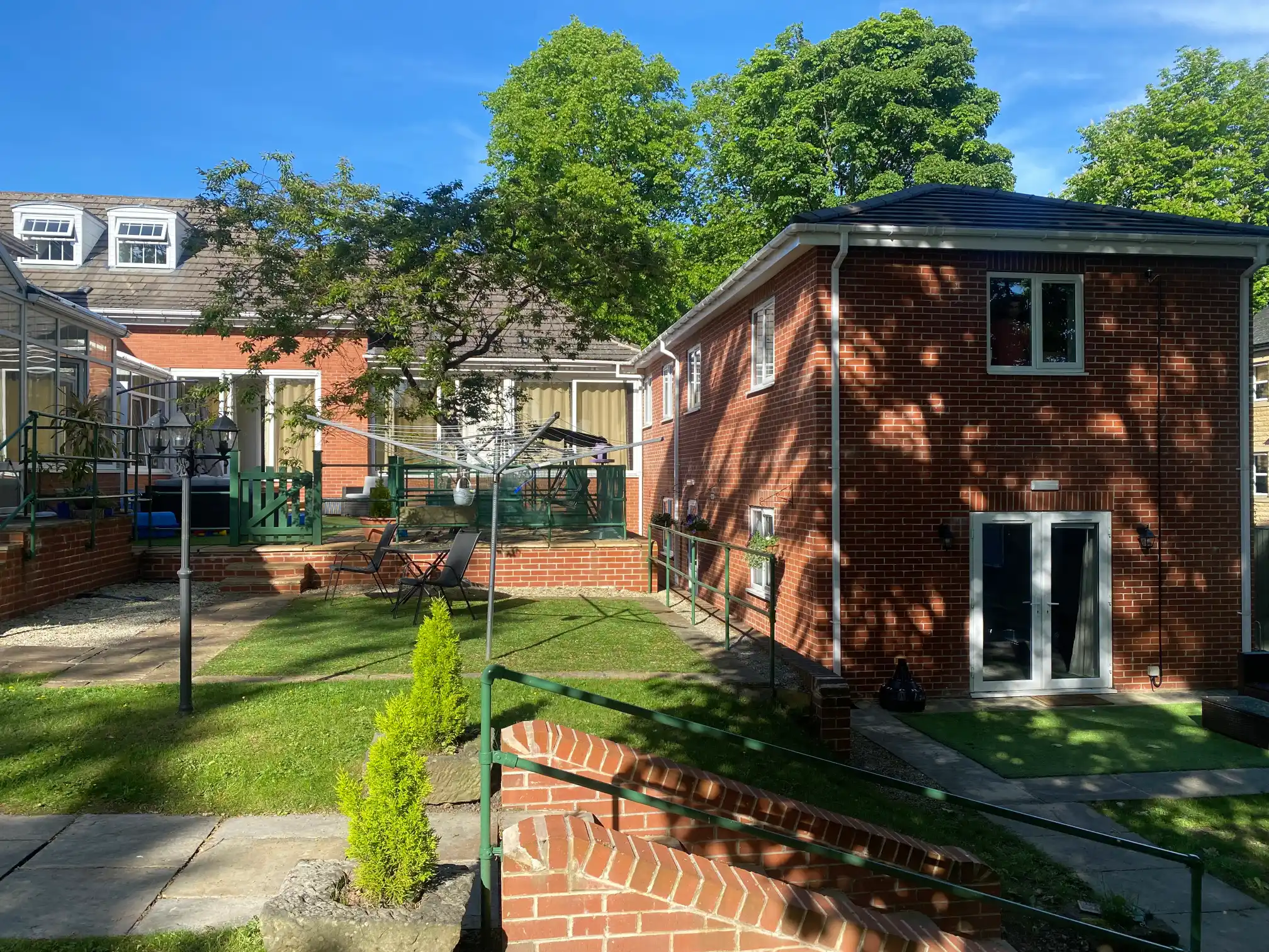 Exterior and garden at The Glades at Moorville
