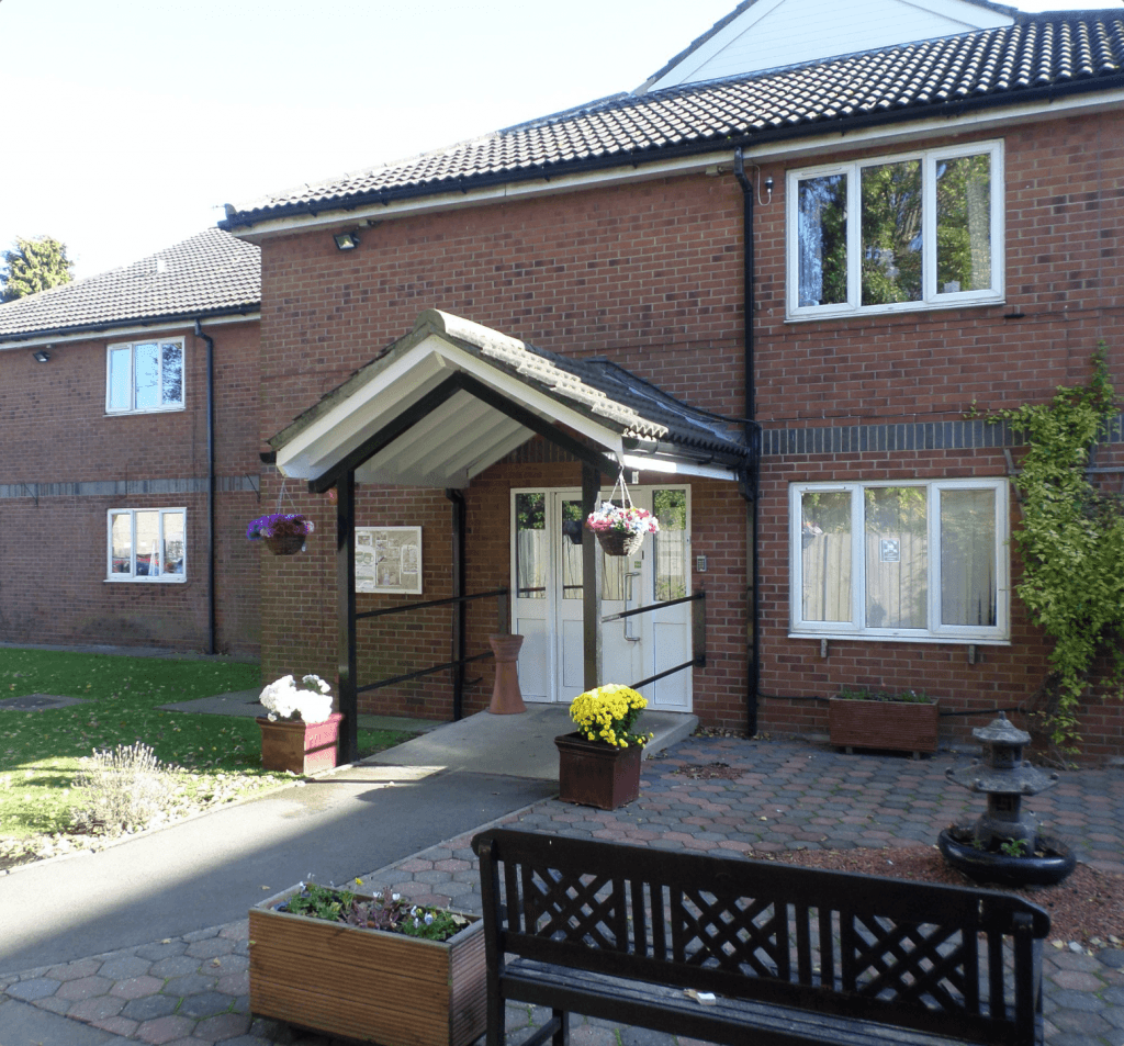 Exterior and entrance at The Poplars Care Home