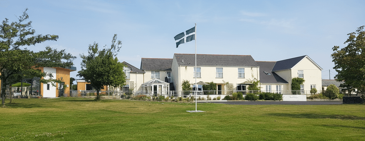 Exterior and front lawn at West Heanton - Residential Home